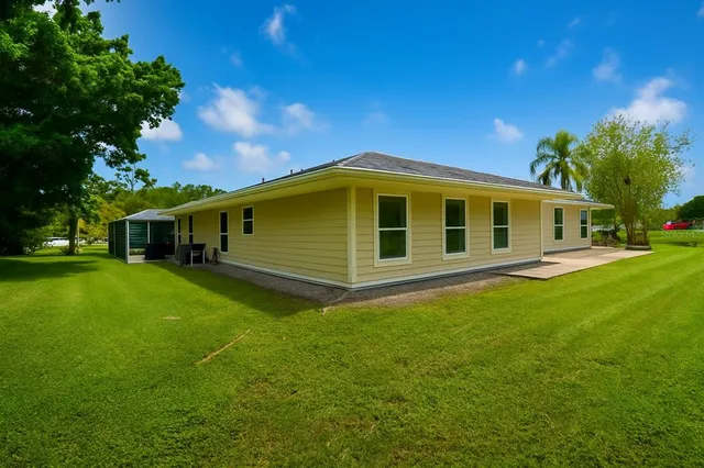 a spacious bedroom with a bed and cabinets