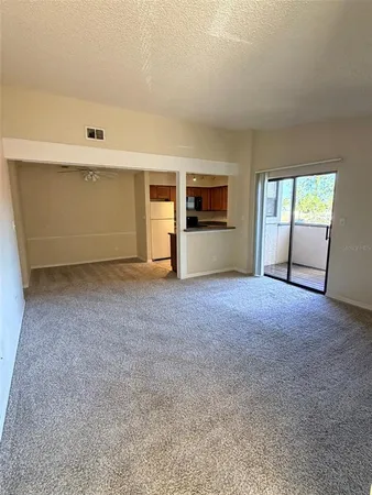 a view of empty room with windows