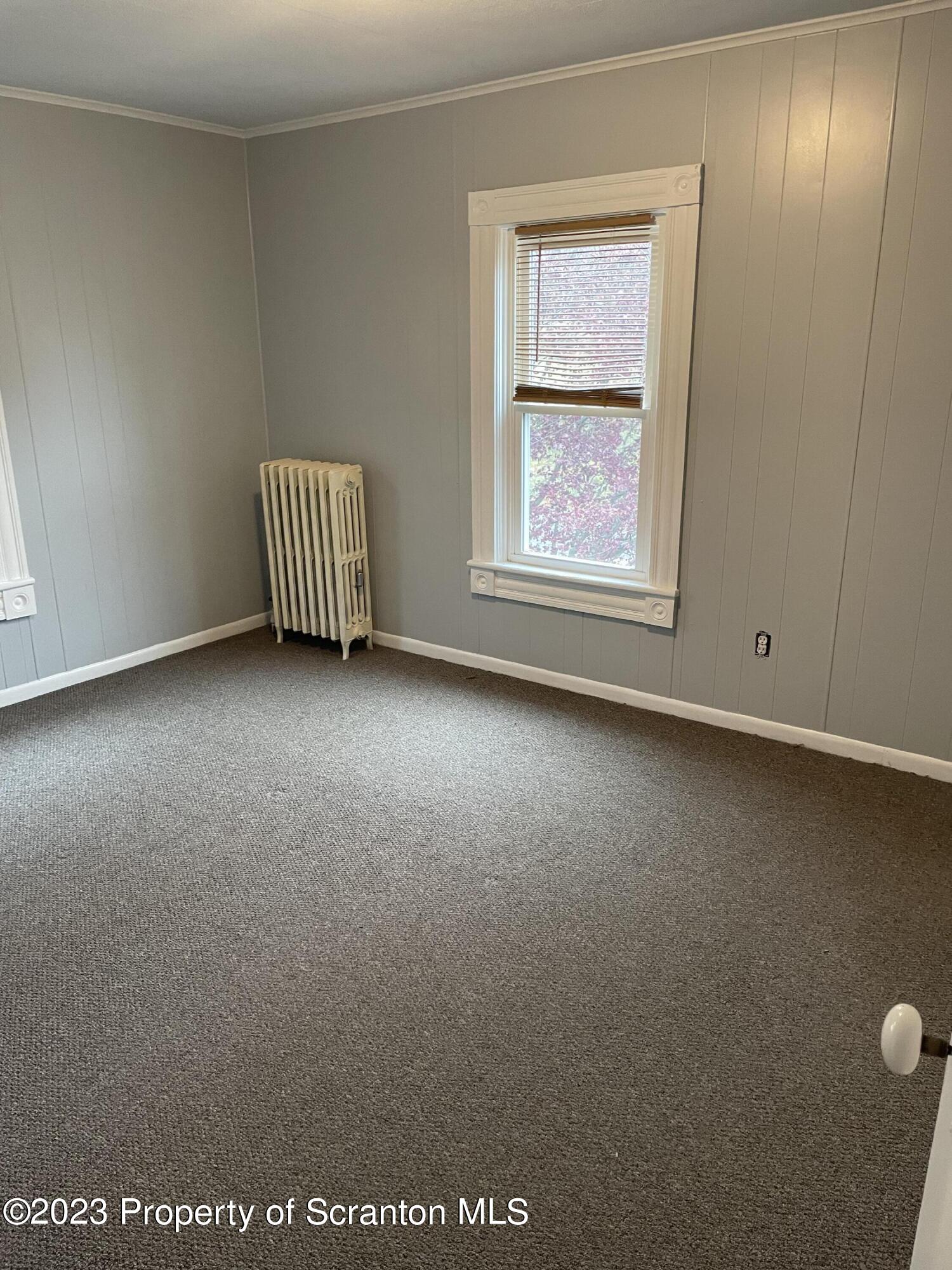 1311 Clay Avenue, Unit 1 Dunmore, PA 18510 - Photo 4 of 8 an empty room with windows