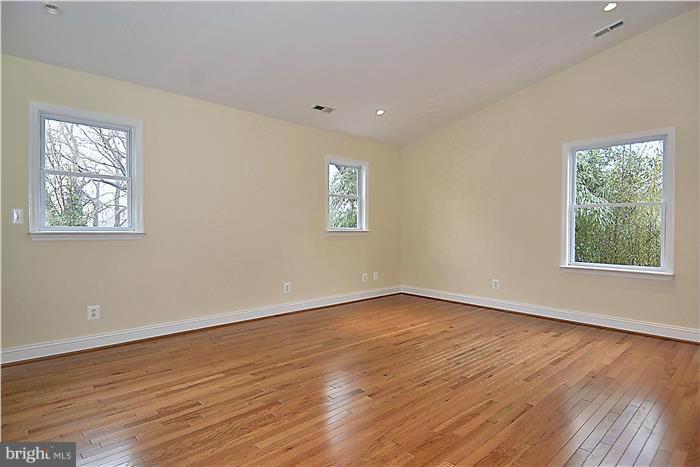 2300 Darrow Street Silver Spring, MD 20902 - Photo 15 of 30 a view of an empty room with wooden floor and a window