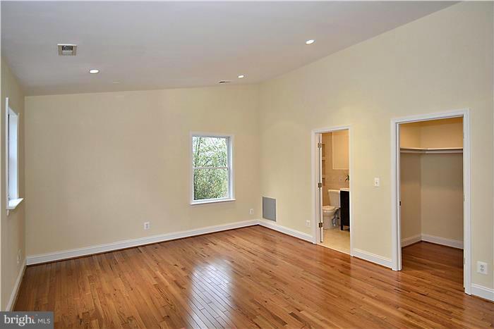 2300 Darrow Street Silver Spring, MD 20902 - Photo 16 of 30 an empty room with wooden floor and windows