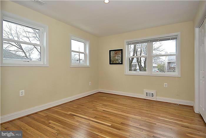 2300 Darrow Street Silver Spring, MD 20902 - Photo 18 of 30 a view of empty room with wooden floor and fan