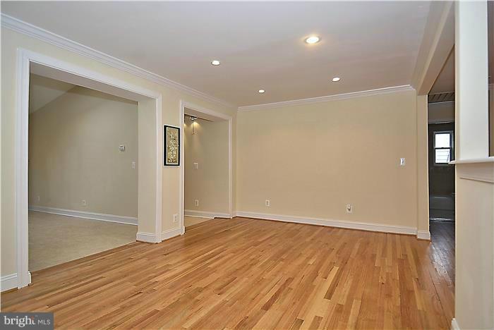 2300 Darrow Street Silver Spring, MD 20902 - Photo 20 of 30 a view of an empty room with wooden floor and a window