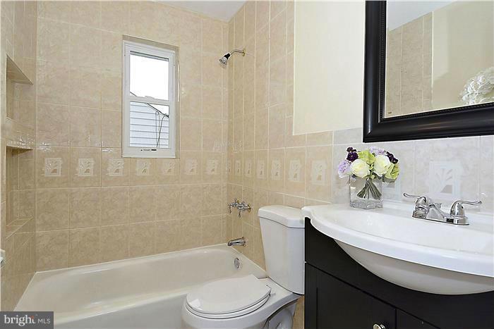2300 Darrow Street Silver Spring, MD 20902 - Photo 21 of 30 a bathroom with a sink a toilet and shower