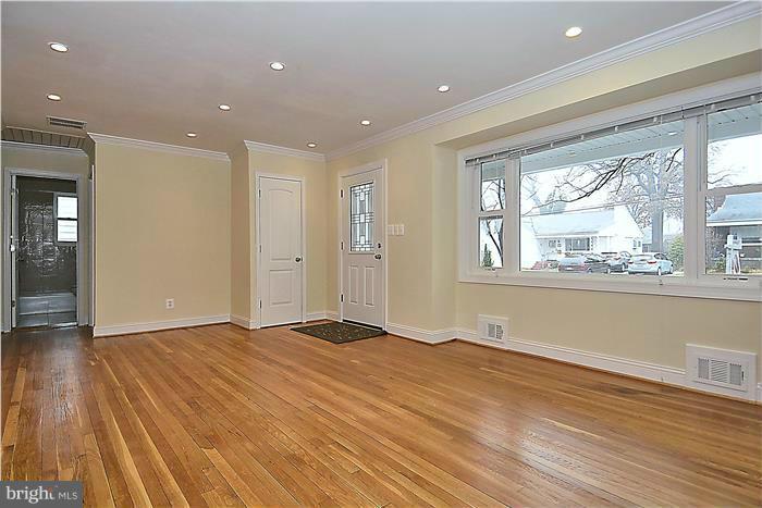 2300 Darrow Street Silver Spring, MD 20902 - Photo 8 of 30 an empty room with wooden floor and windows