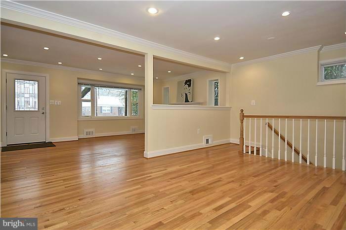 2300 Darrow Street Silver Spring, MD 20902 - Photo 9 of 30 an empty room with wooden floor and windows