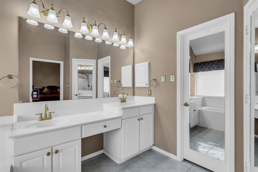 513 Cameron Lane Allen, TX 75002 - Photo 20 of 33 Another view of the master bath with a mirrored door leading into a spacious master closet.
