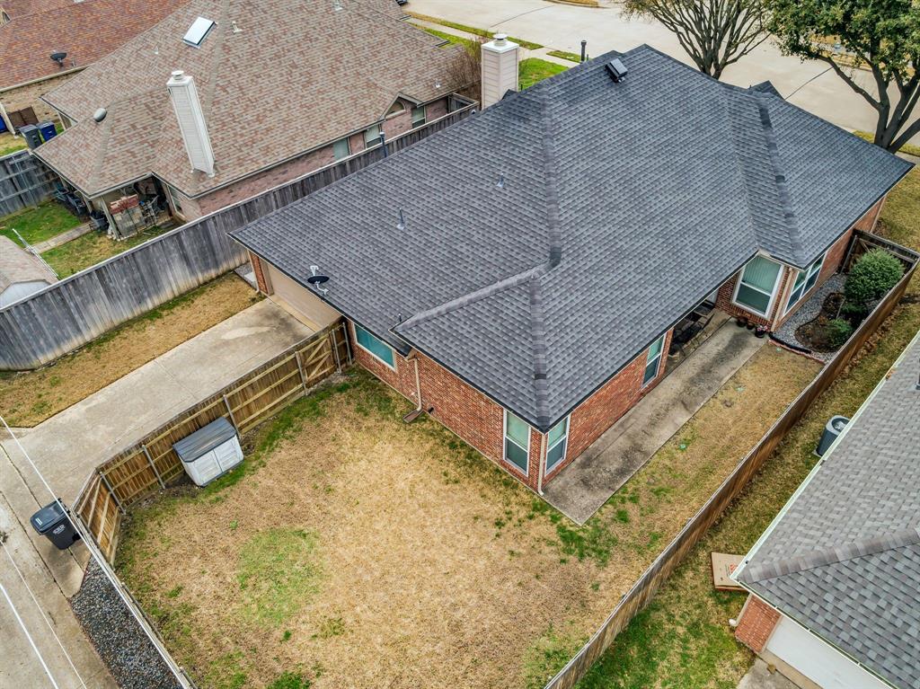 513 Cameron Lane Allen, TX 75002 - Photo 29 of 33 This aerial view shows the shape and size of the back yard along with the driveway to the garage.