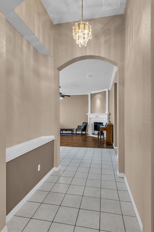 513 Cameron Lane Allen, TX 75002 - Photo 4 of 33 Notice the decorative niche to the left as you are welcomed by the arched entry leading into the spacious informal living room.