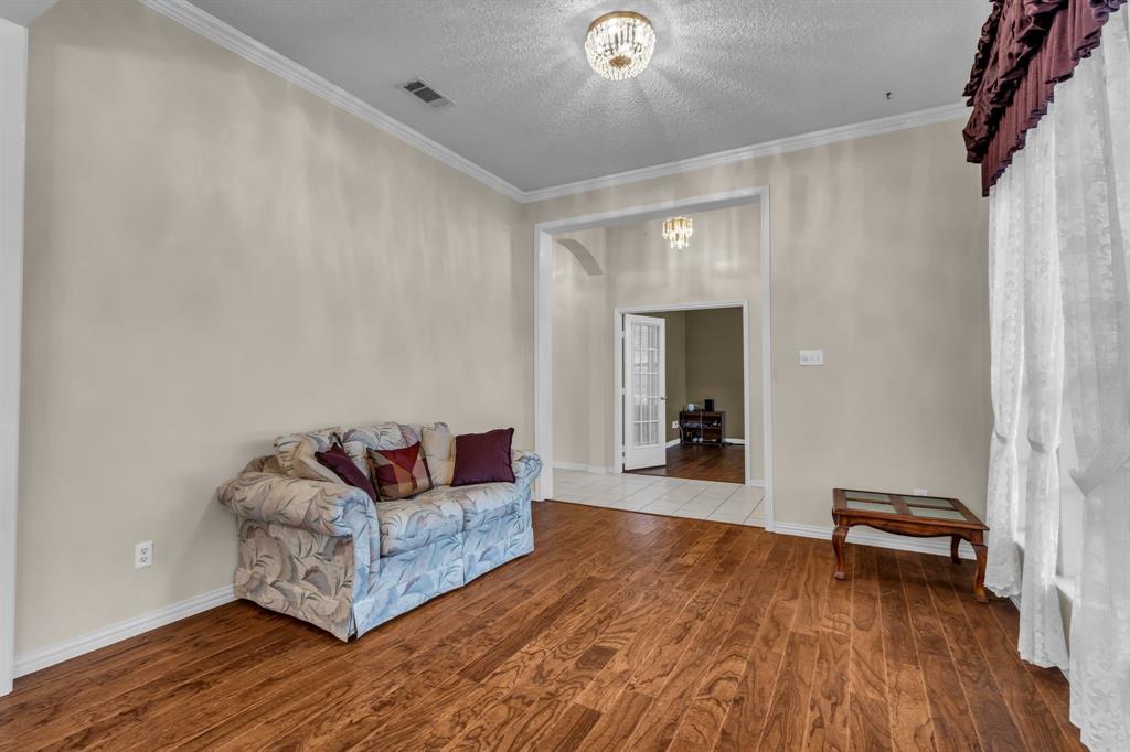 513 Cameron Lane Allen, TX 75002 - Photo 7 of 33 A view of the formal living area from the angle of the dining room.