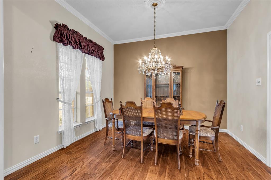 513 Cameron Lane Allen, TX 75002 - Photo 8 of 33 Notice the beautiful crystal chandelier in this lovely dining room!