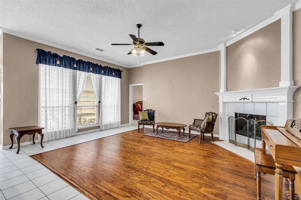 513 Cameron Lane Allen, TX 75002 - Photo 10 of 33 Notice the crown molding and lovely ornate fireplace surround.