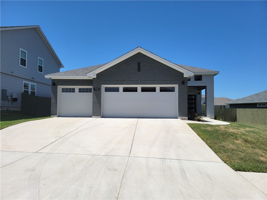 9709 Eloquence Dr Manor Manor, TX 78653 - Photo 1 of 1 a front view of a house with a yard