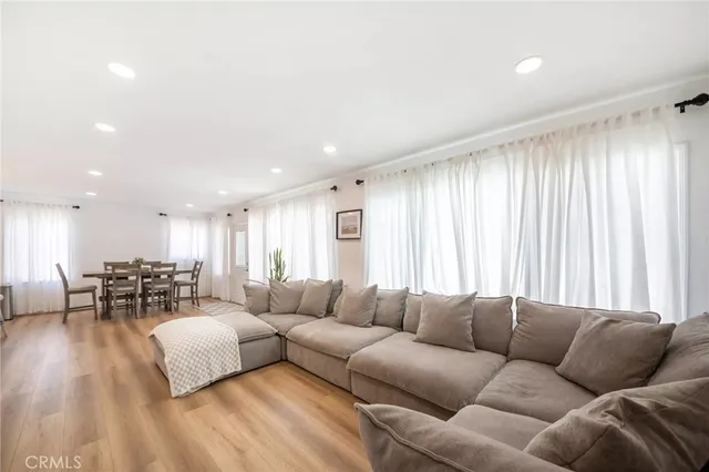 a large kitchen with a table and chairs