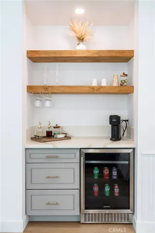 a view of a hallway with paintings on the wall