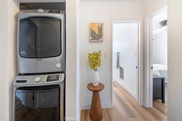 a large bed sitting in a bedroom next to a window