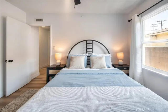 a bedroom with a bed and a closet