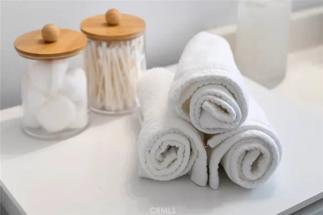 a outdoor space with the couches and dining table under an umbrella