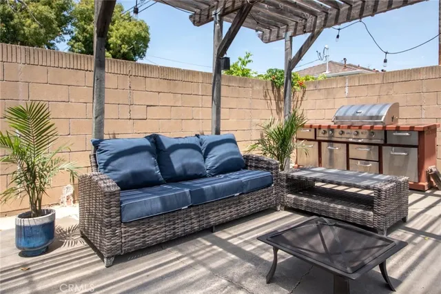 a view of a backyard with sitting area