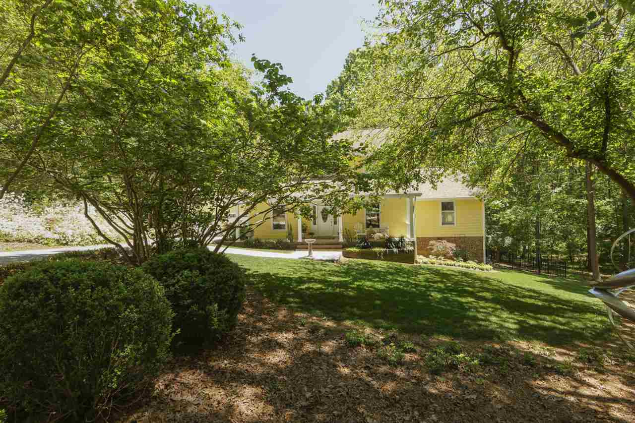 Main floor living with first floor owner suite! New exterior paint. You will love the beatuiful setting and low costs (No HOA, No City Tax and No water or sewer bill!) Exterior Front