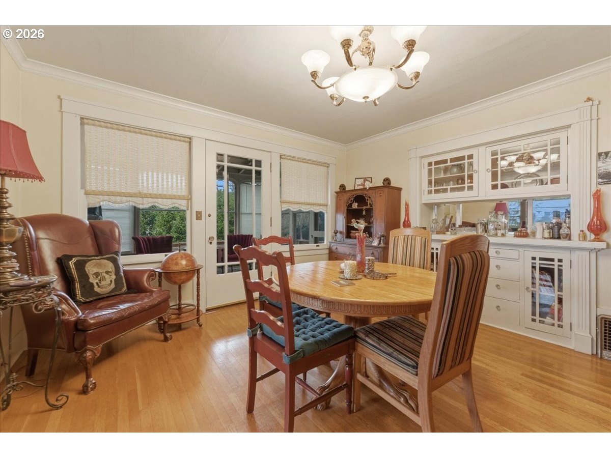 706 West B Street Rainier, OR 97048 - Photo 8 of 47 a view of a dining room with furniture window and wooden floor