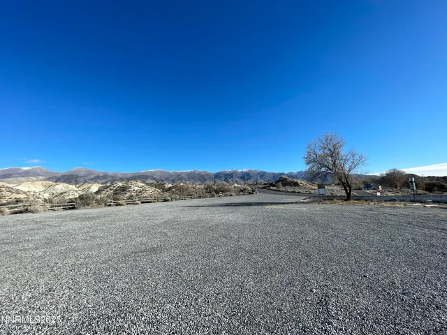 a view of an ocean beach and mountain