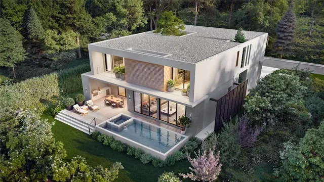 a view of house with roof deck and seating space