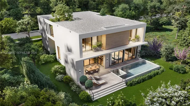 a view of a house with roof deck and yard