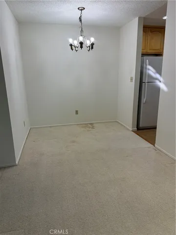 a kitchen with a sink and a refrigerator