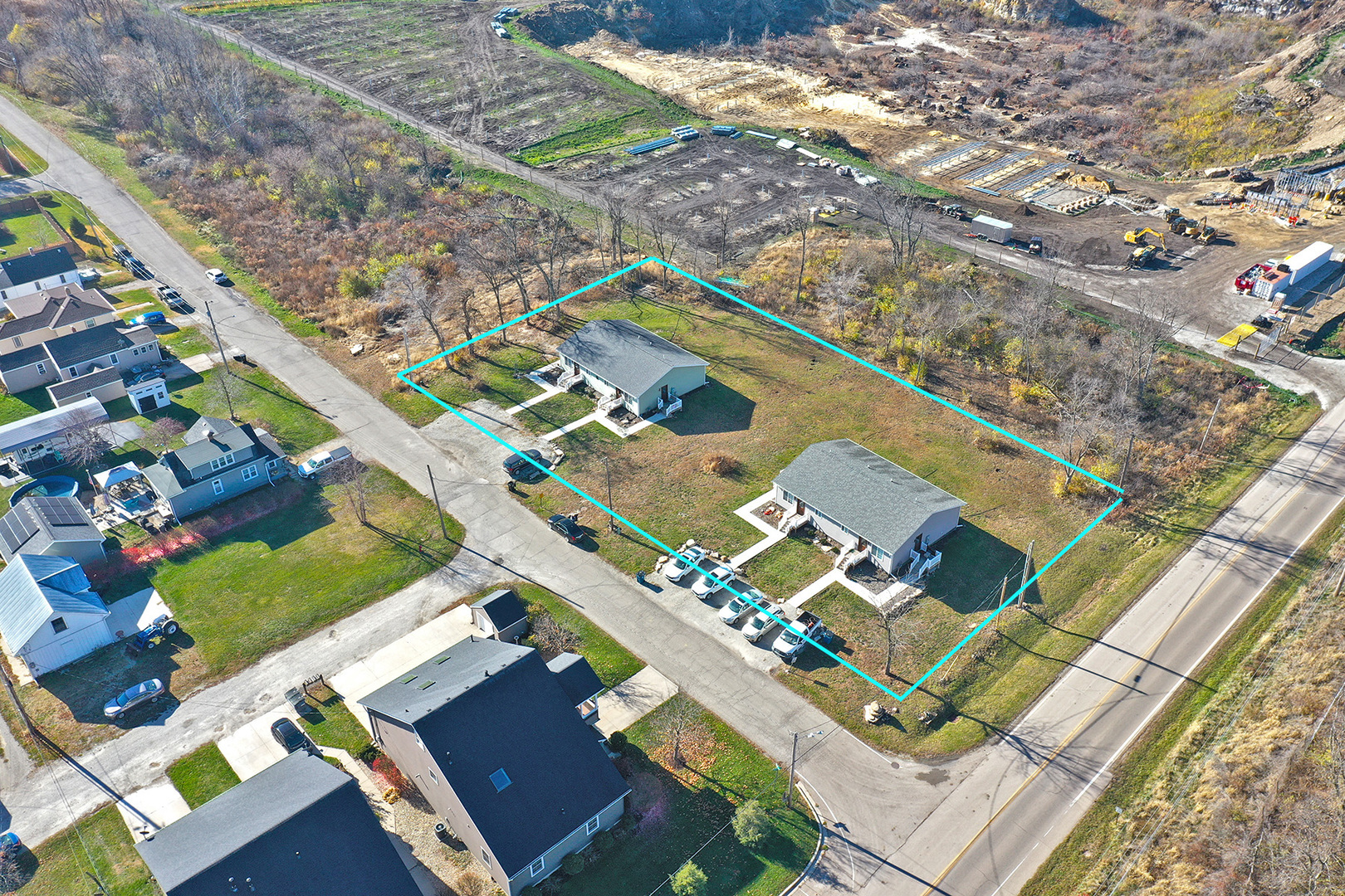 an aerial view of residential houses with outdoor space