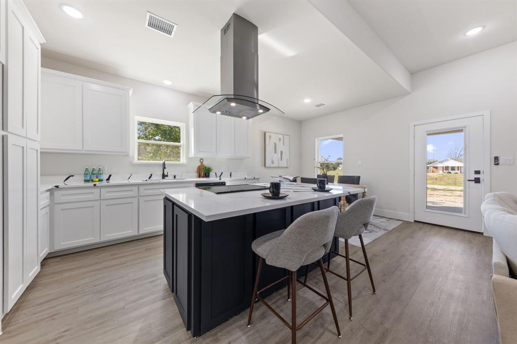 315 Windjammer Road Gun Barrel City, TX 75156 - Photo 14 of 32 a kitchen with a sink cabinets and wooden floor