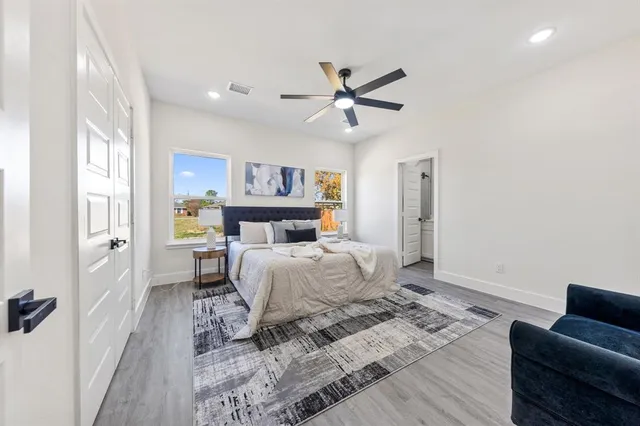 a bedroom with a bed and a couch