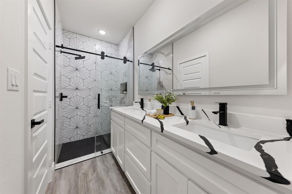 315 Windjammer Road Gun Barrel City, TX 75156 - Photo 21 of 32 a bathroom with a tub sink and shower