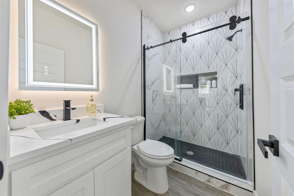 315 Windjammer Road Gun Barrel City, TX 75156 - Photo 25 of 32 a bathroom with a sink a toilet and shower