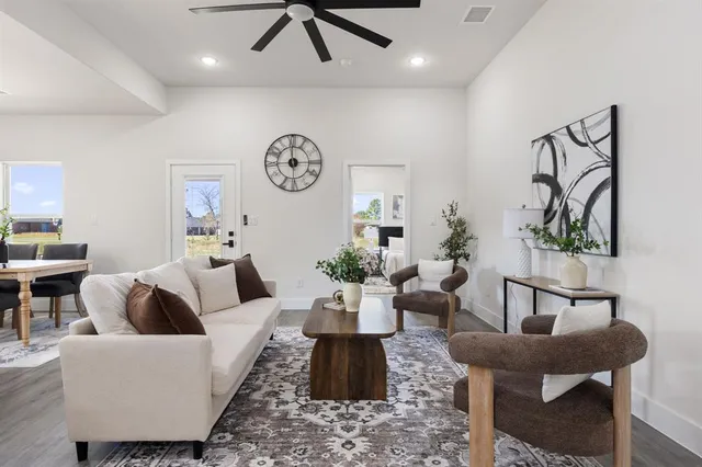 a living room with furniture and a large window