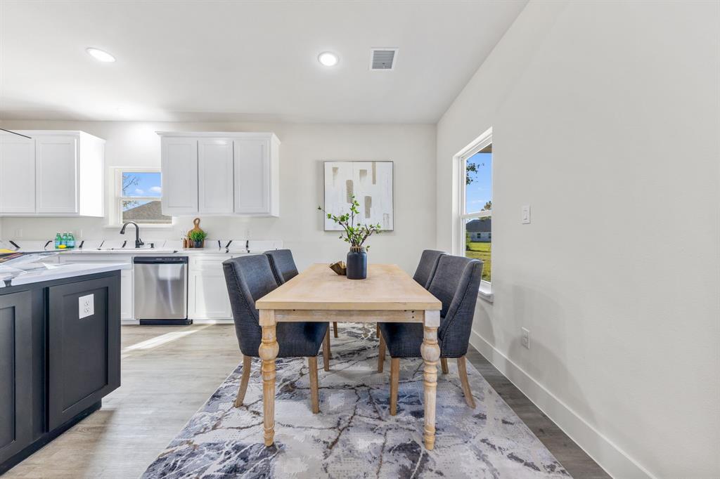 315 Windjammer Road Gun Barrel City, TX 75156 - Photo 9 of 32 a living room with stainless steel appliances furniture a dining table and a window