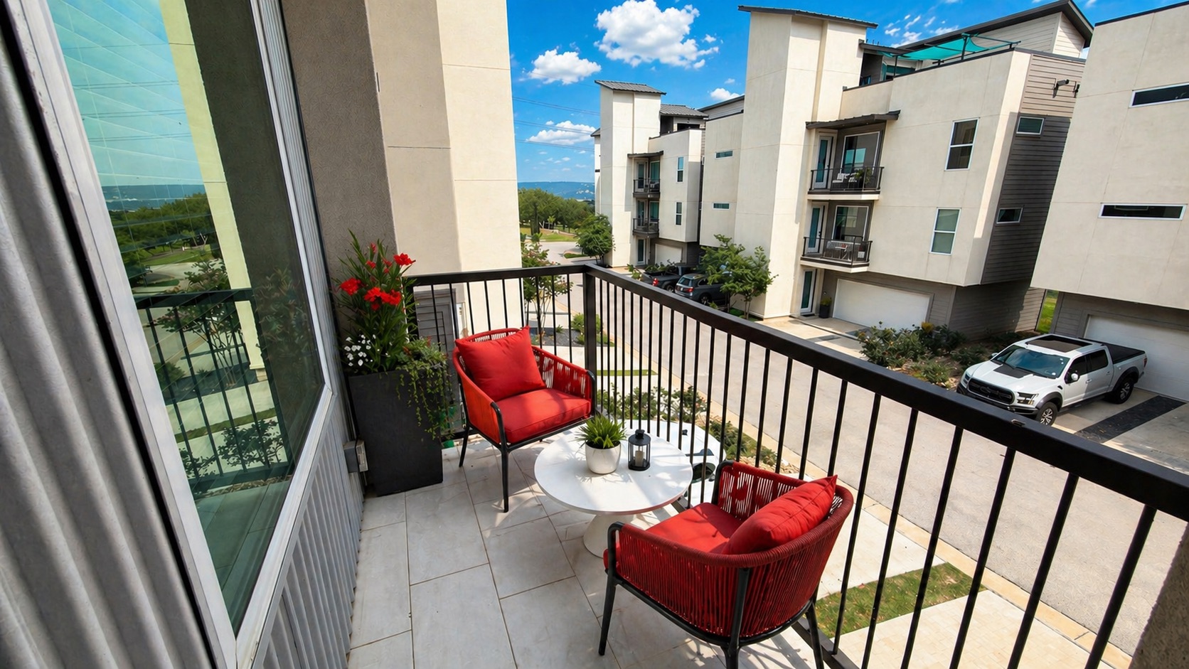 4300 Mansfield Dam Road, Unit 1021 Austin, TX 78734 - Photo 15 of 40 Balcony featuring light-toned tile flooring, black metal railing, and a window, off the dining room.