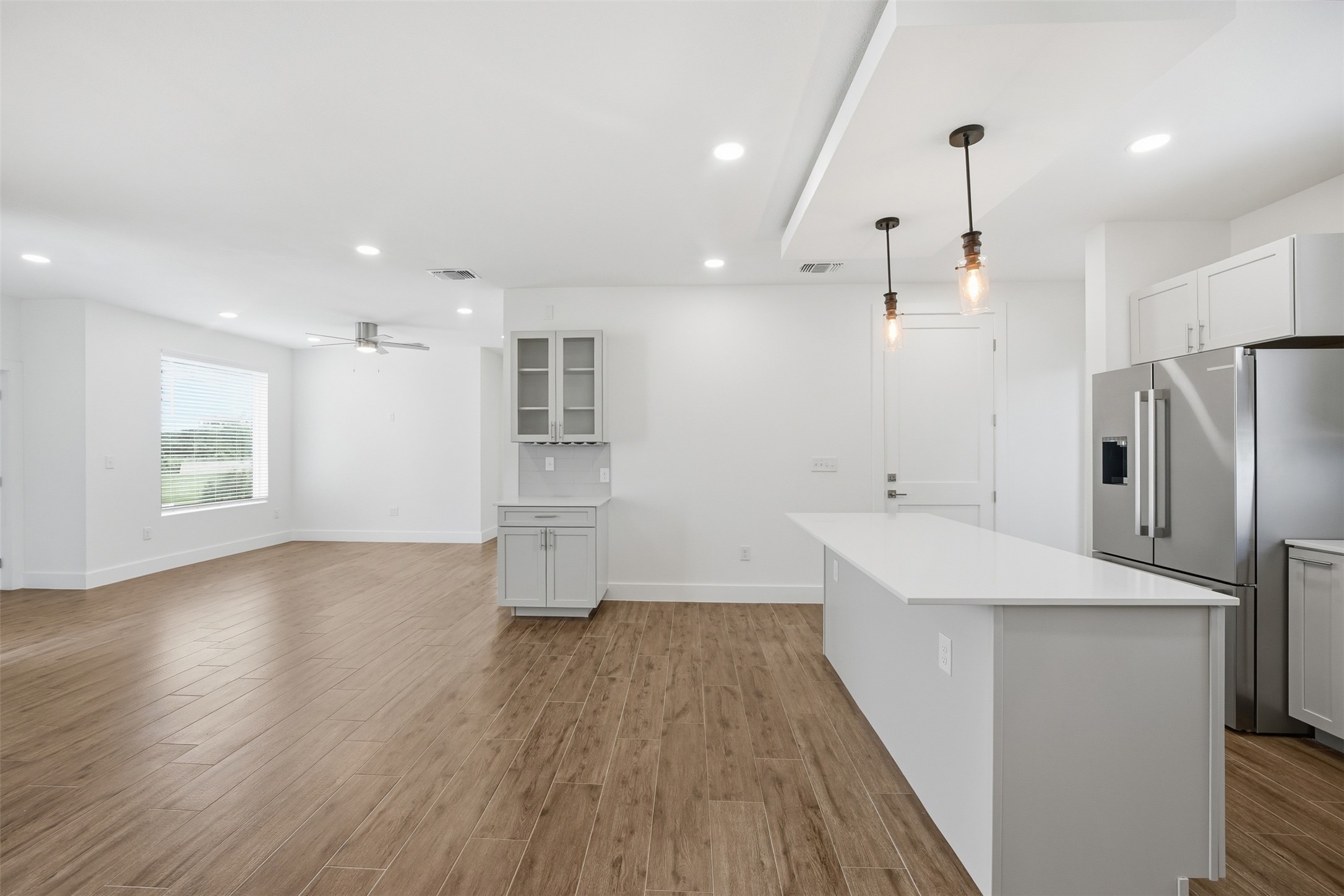 4300 Mansfield Dam Road, Unit 1021 Austin, TX 78734 - Photo 17 of 40 Open-concept living area featuring wood-finish flooring, recessed lighting, and a modern ceiling fan