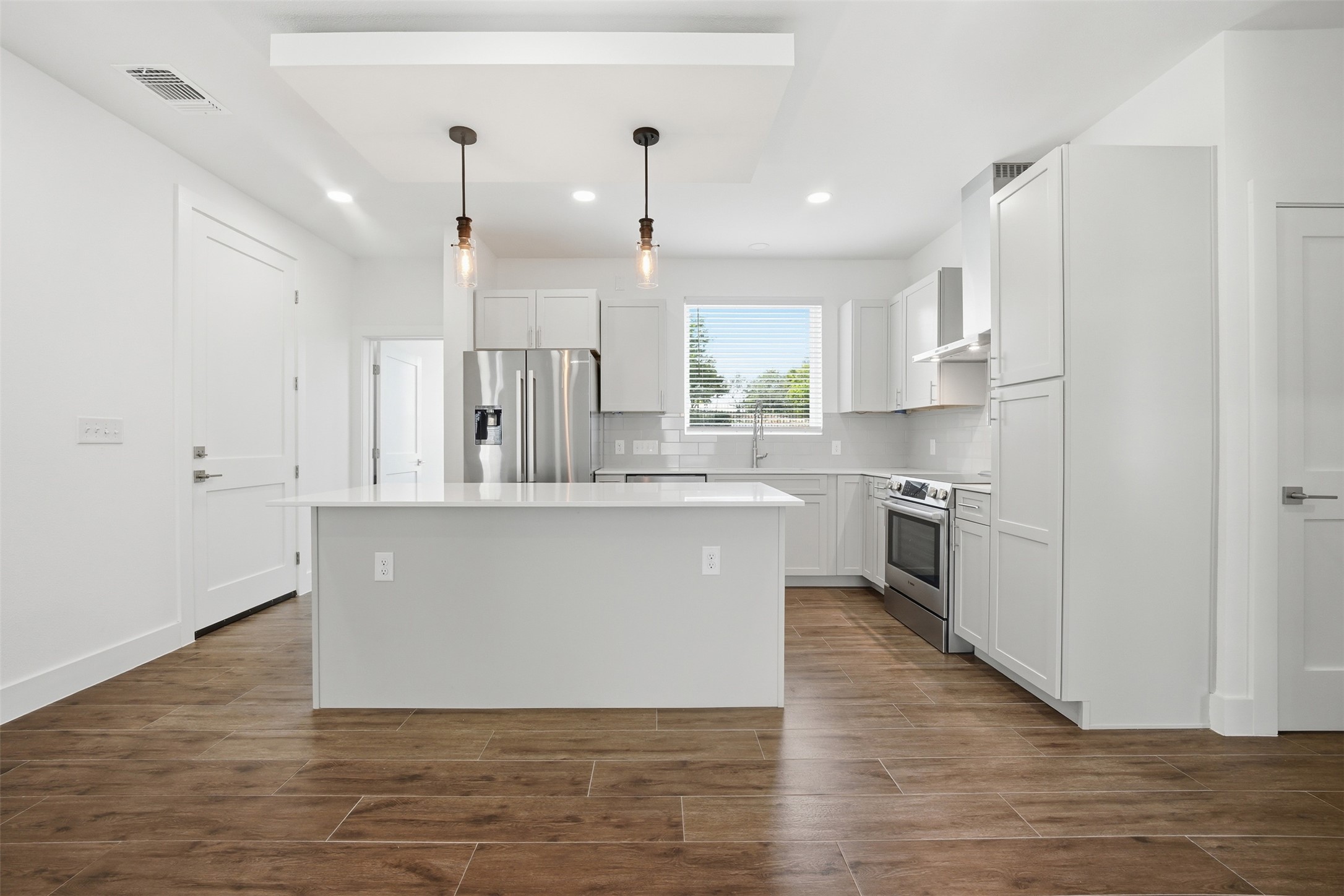4300 Mansfield Dam Road, Unit 1021 Austin, TX 78734 - Photo 22 of 40 Abundant counter space and cabinetry, plus a well-designed pantry cabinet with convenient pull-out drawers for added storage.