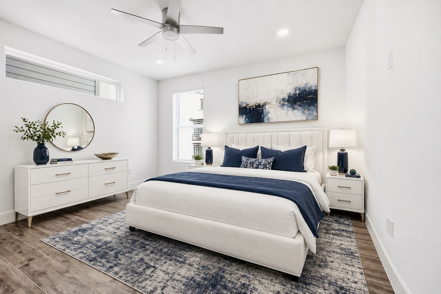 4300 Mansfield Dam Road, Unit 1021 Austin, TX 78734 - Photo 25 of 40 Spacious primary bedroom featuring wood-look tile -finish flooring, recessed lighting, a contemporary ceiling fan, a horizontal clerestory window, and a vertical window with blinds.