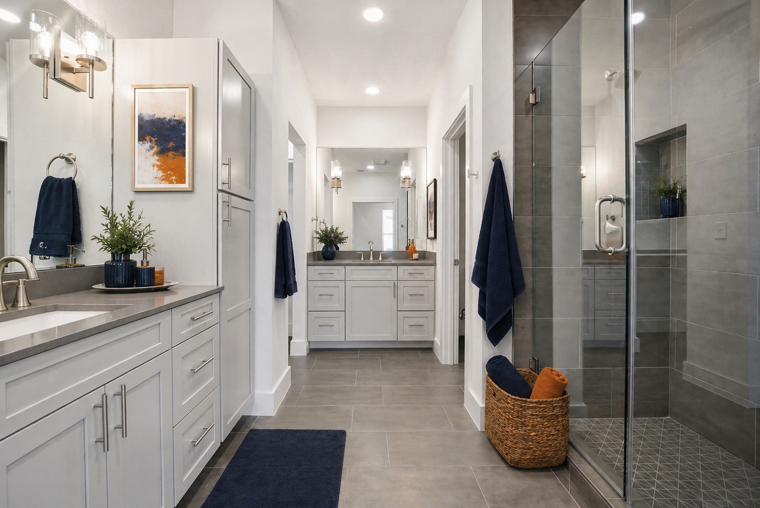 4300 Mansfield Dam Road, Unit 1021 Austin, TX 78734 - Photo 26 of 40 Elegant primary bath featuring a dual vanity with gray cabinetry and integrated sinks, brushed nickel fixtures, a large seamless glass shower with seating, a walk-in closet, and a private water closet.