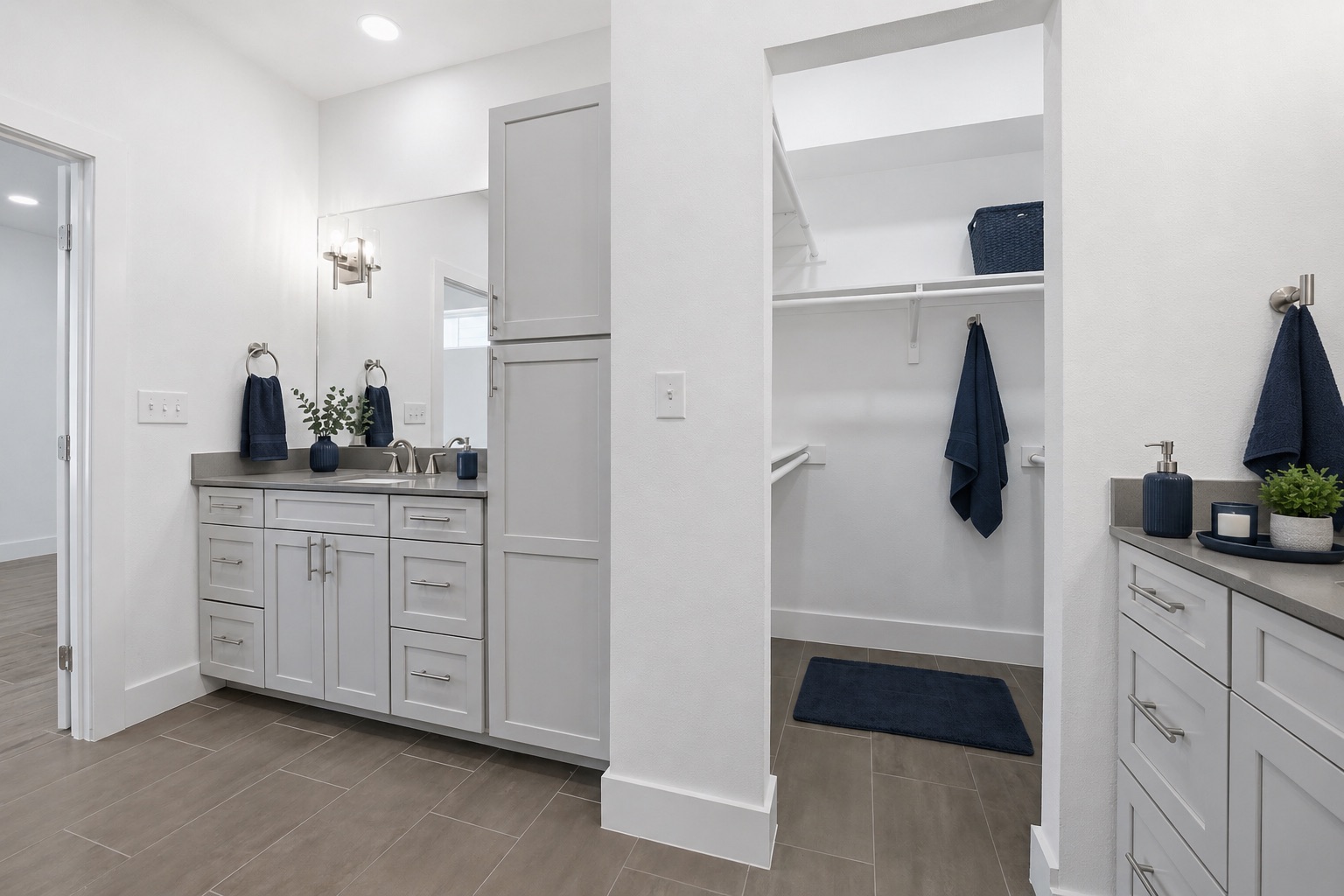 4300 Mansfield Dam Road, Unit 1021 Austin, TX 78734 - Photo 27 of 40 Bathroom vanity featuring light gray cabinetry with brushed nickel hardware, a gray countertop, and a recessed sink