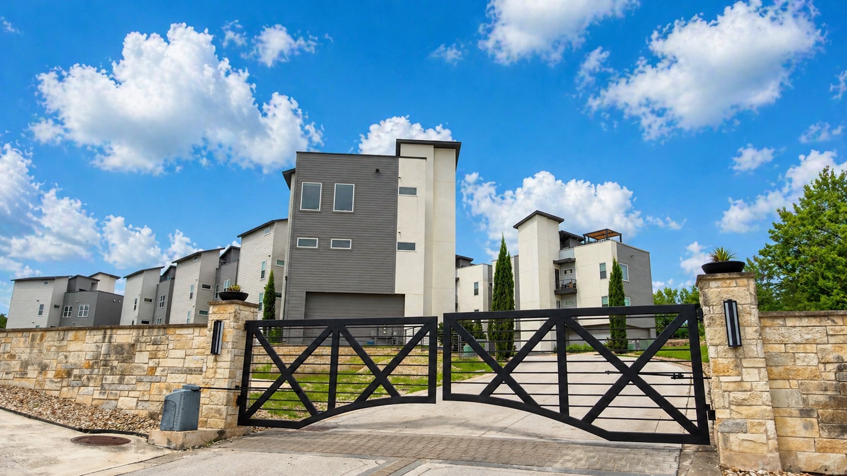 4300 Mansfield Dam Road, Unit 1021 Austin, TX 78734 - Photo 6 of 40 Gated entry featuring stone pillars and wrought iron gates