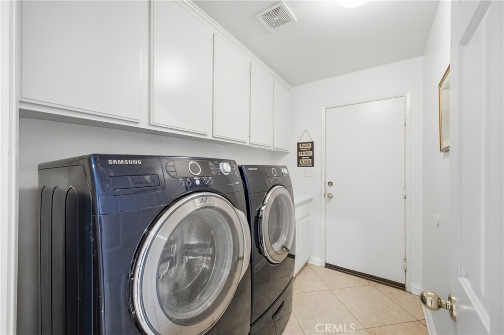 785 Pine Ridge Circle Beaumont, CA 92223 - Photo 11 of 60 Main level laundry room with sink, leads to a 3car garage