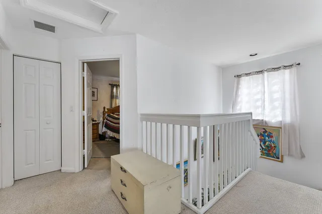 a view of a hallway with a bedroom