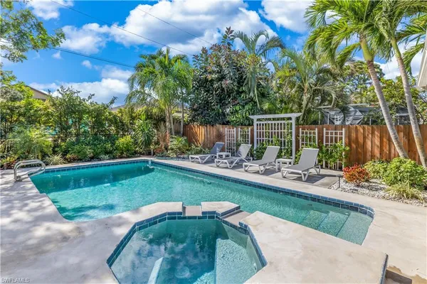 a view of a backyard with sitting area