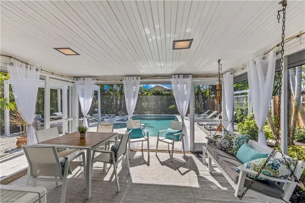 a view of an outside dining space with furniture