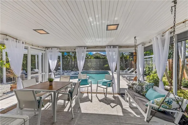 a view of an outside dining space with furniture