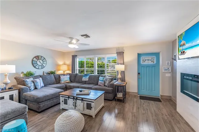 a living room with furniture and a window