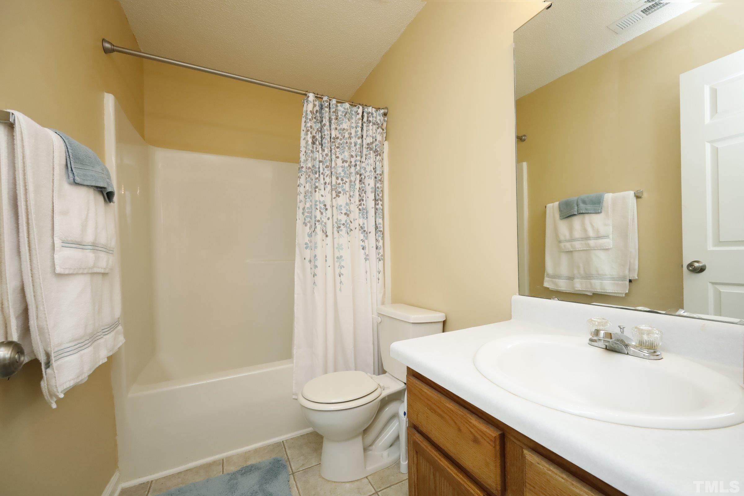 3608 Marshlane Way Raleigh, NC 27610 - Photo 32 of 43 a bathroom with a sink a toilet and shower